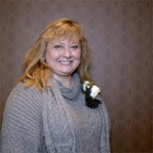 lady smiling wearing flowers in dress